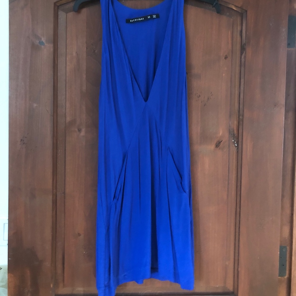 Blue plunging midi dress.